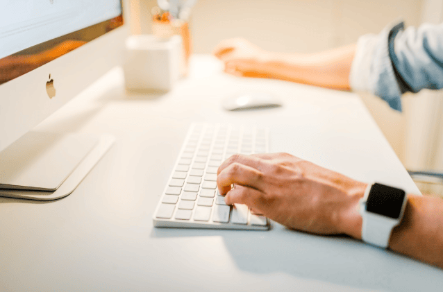 An individual utilizing online fax services to enhance efficiency in modern business operations